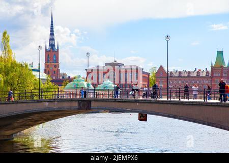 Stockholm, Sweden - May 21, 2015: Pedestrian bridge with walking people in Stockholm Stock Photo