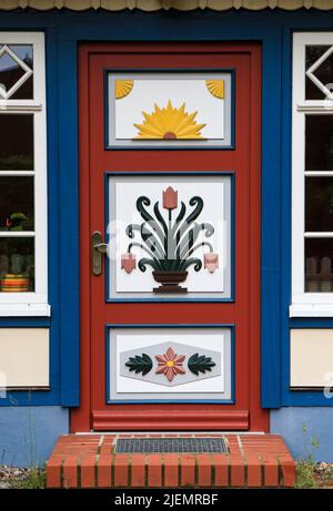 Old traditional painted door of a Fisherman's house in Northern Germany near the Baltic Sea Stock Photo