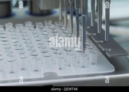 Automatic ampoule filling machine at pharmacy factory - close up Stock Photo