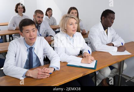 Group of physicians during seminar Stock Photo