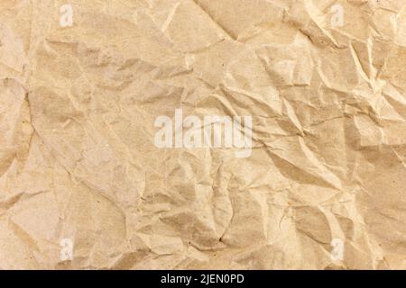 Crumpled brown craft paper texture, rustic recycle material Stock Photo