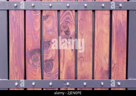 Wooden fence texture with metal construction Stock Photo
