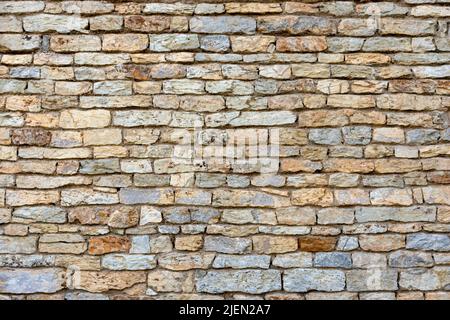 Slate, stone and brick wall texture background of the building or fence Stock Photo