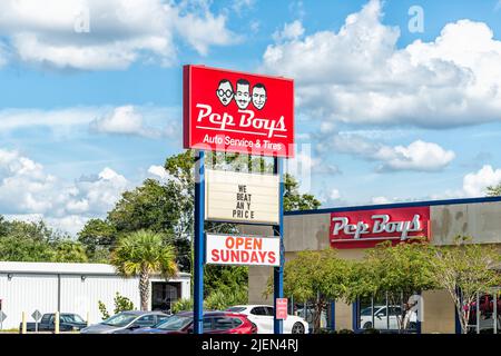 Port Richey, USA - October 4, 2021: Florida city on gulf coast with sign by building for Pep Boys auto service mechanic and tires with text for we bea Stock Photo