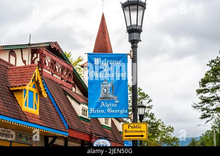 Helen, USA - October 5, 2021: Bavarian village of Helen, Georgia with welcome sign for famous Oktoberfest festival in fall season with tower architect Stock Photo