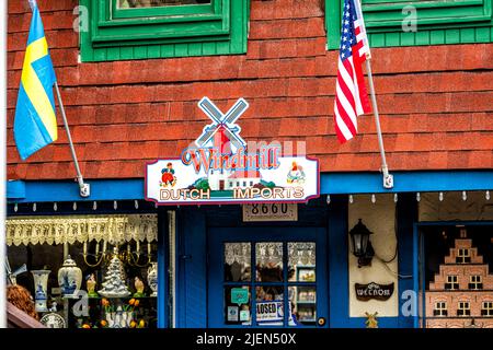 Helen, USA - October 5, 2021: Helen, Georgia Bavarian village town building with sign for gift shop store on Main street for Dutch Windmill imports an Stock Photo