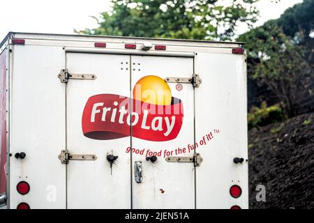 Sylva, USA - October 6, 2021: Truck back closeup on street road in small town in North Carolina countryside with advertisement for Frito-Lay company s Stock Photo