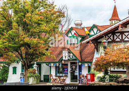 Helen, USA - October 5, 2021: Helen, Georgia Bavarian town with sign on building for Village Crepe Haus restaurant at Oktoberfest festival with tradit Stock Photo