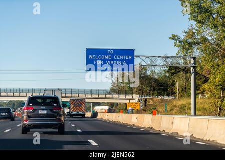 Fredericksburg, USA - October 18, 2021: Highway i-95 interstate road cars on commute in morning traffic near Washington DC and sign for Virginia Welco Stock Photo