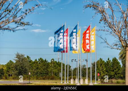 Jacksonville, USA - October 19, 2021: Sign on colorful banners flag for IKEA home furnishings furniture warehouse center store in Florida Stock Photo