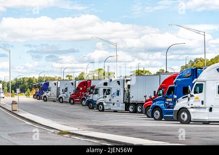 Wekiwa Springs, USA - October 19, 2021: Florida highway interstate i4 road near Orlando with rest stop area and many rows of trucks parked in parking