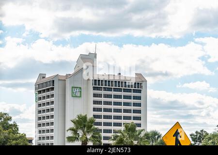 Orlando, USA - October 19, 2021: Building sign for Holiday Inn Express hotel in Florida city near Lake Buena Vista city in summer sunny weather with c Stock Photo