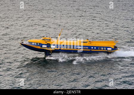 Piraeus, Athens, Greece - June 2022: High speed hydrofoil ferry after leaving the port of Piraeus Stock Photo