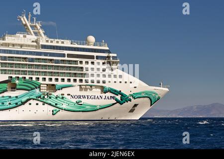 Mykonos, Greece - June 2022: Side view of the front of the Norwegian Jade cruise ship anchored at sea off the Greek Island. Stock Photo