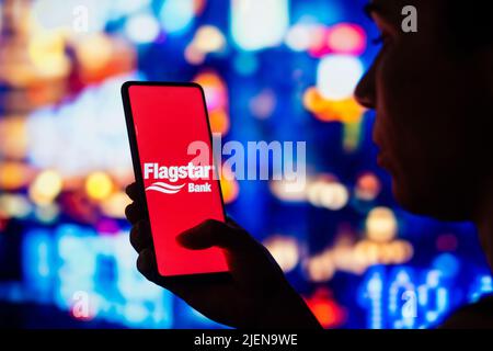 Brazil. 27th June, 2022. In this photo illustration, a silhouetted woman holds a smartphone with the Flagstar Bank logo displayed on the screen. (Credit Image: © Rafael Henrique/SOPA Images via ZUMA Press Wire) Stock Photo