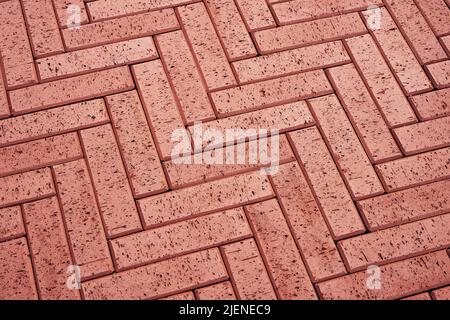 Redbrick paving stones on a sidewalk or pavement. Top view Stock Photo