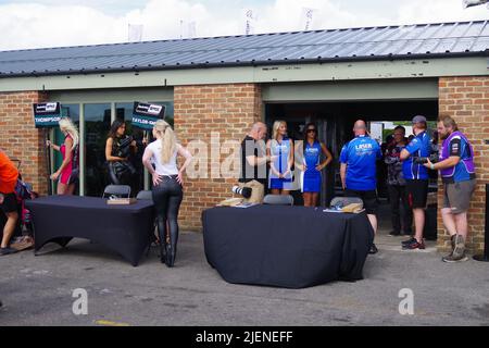 Croft, England, 26 Jun 2022. Preparing for the pit lane walkabout and autograph session at the British Touring Car Championship at Croft Circuit. Credit: Colin Edwards Stock Photo