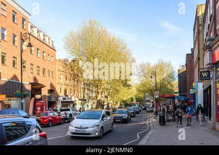 Hampstead High Street on a spring afternoon, teeming with people Stock Photo