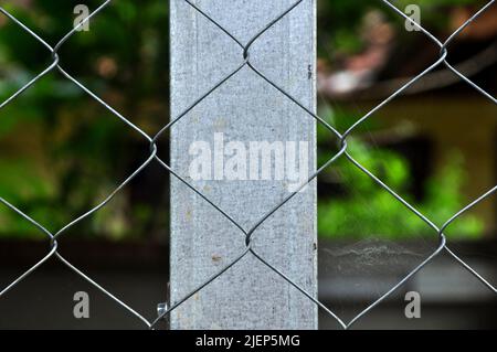 Home yard fence security wire Stock Photo