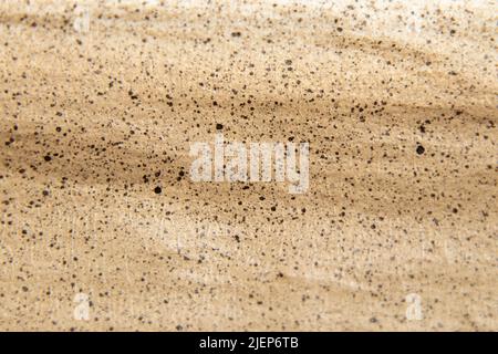 brown paper with spots of paint for the background, splashes of paint on paper as a background, watercolor Stock Photo