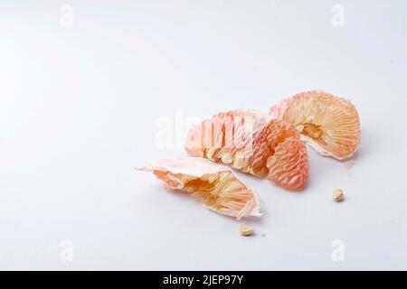 Peeled Fresh Juicy Pomelo Pulp and Peel Isolated on White Background, Copy Space Stock Photo