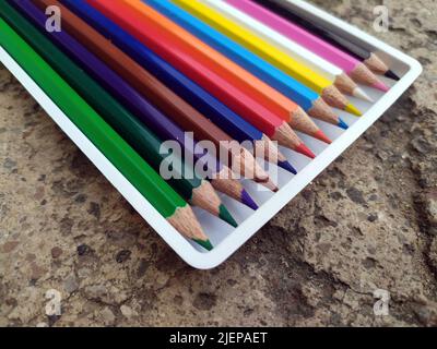 Banner of color pencils on light gray blue background. Top view with space for text. Back to school concept. Flat lay stationery mockup. Bright backpl Stock Photo