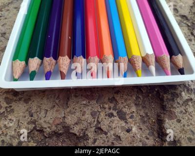 Banner of color pencils on light gray blue background. Top view with space for text. Back to school concept. Flat lay stationery mockup. Bright backpl Stock Photo