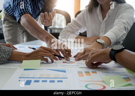 Group of young asian creative business brain storm meeting presentation,discussing roadmap to product launch, planning,strategy,new business Stock Photo