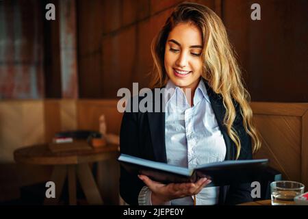 Successful business woman or entrepreneur taking notes and working. City business woman working. Stock Photo