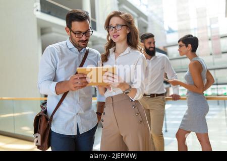 Happy group of young business people friends discussing brainstorming ideas at meeting Stock Photo