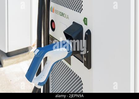 ALFAFAR, SPAIN - JUNE 06, 2022: Electric car charging station powered by Iberdrola Stock Photo