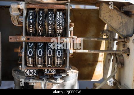 A counter of an old and abandoned petrol pump. numbers on the counter. Stock Photo