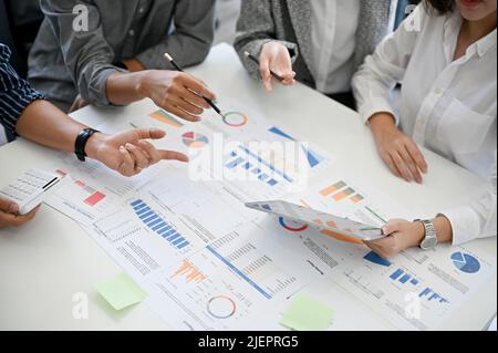 A group of professional financial consultant workers having a financial meeting, brainstorming their financial strategy. Stock Photo