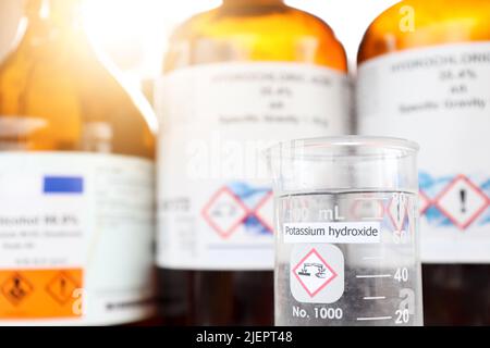Potassium hydroxide liquid in glass, chemical in the laboratory and industry Stock Photo