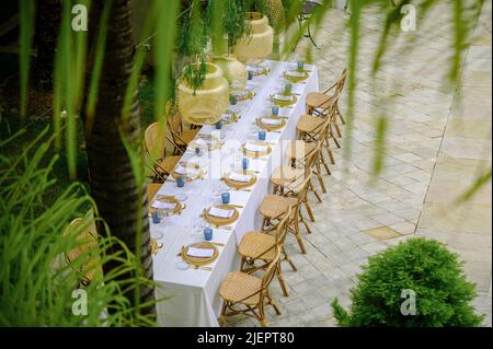 Served table for banquet on terrace Stock Photo