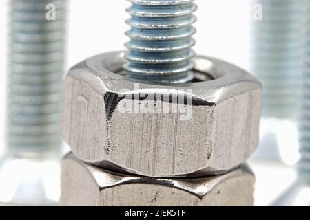 Close-up nuts and bolts isolated on white background Stock Photo