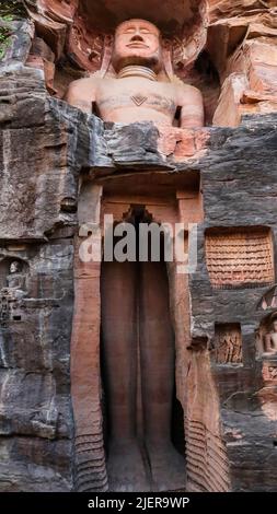 Standing colossus Rock-cut Jain sculpture of 57 Feet the largest of the group at Sidhhachal Caves, Gwalior Fort, Madhya Pradesh, India. Urvai Group Stock Photo