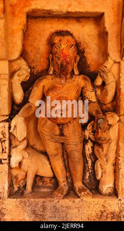 Sculpture of Hindu God on the Temple of Lord Shiva at Bateshwara Group of Temples, Morena, Madhya Pradesh, India. Stock Photo