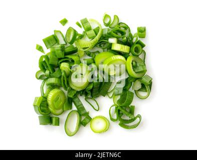 Chopped stems of green onion or chives isolated on white, top view. Stock Photo