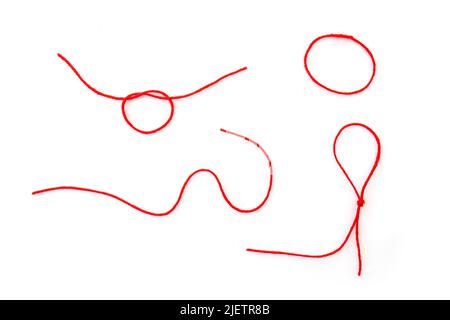 Abstract shapes by woolen red thread, rope isolated on white, top view Stock Photo
