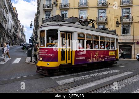 Lisbon, Portugal. 24th June, 2022. A tram rides through the streets of the Baixa district in Lisbon. Credit: SOPA Images Limited/Alamy Live News Stock Photo