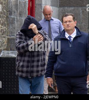 Suspect being led away from court in handcuffs Stock Photo