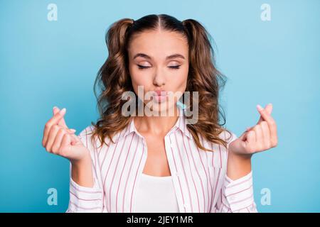 Photo portrait flirty girlfriend sending air kiss closed eyes asking money isolated vivid blue color background Stock Photo