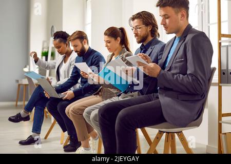 Multiracial group of people sitting in office and waiting for their job interview Stock Photo