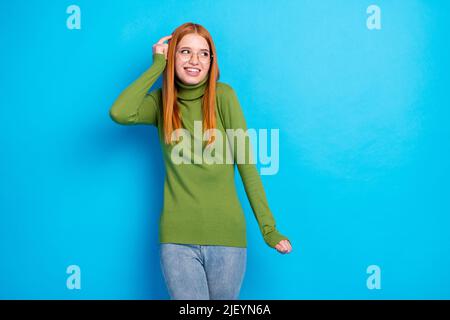Portrait of attractive puzzled cheerful shy girl overthinking copy space clue isolated over bright blue color background Stock Photo