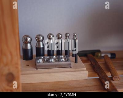 Lifestyle concept, work from home to reinvent your life - Jewelry designer workplace. making tools for jewelry. Georgian minankari enamel manufacturin Stock Photo