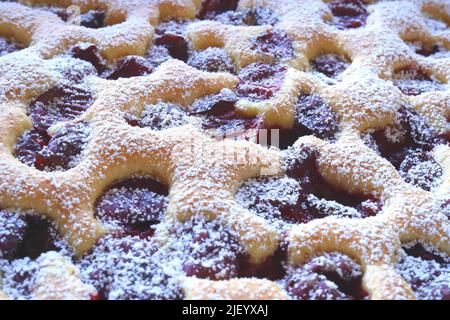 Meggyes pite, Meggyes lepeny, traditional home made Hungarian sour cherry cake with icing sugar Stock Photo