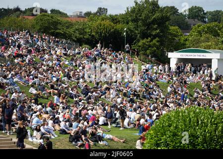 Spectators on the Hill on day two of the 2022 Wimbledon Championships at the All England Lawn Tennis and Croquet Club, Wimbledon. Picture date: Tuesday June 28, 2022. Stock Photo