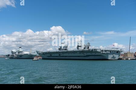 Unusual sight with Britain's two aircraft carriers docked together in Portsmouth naval base. HMS Queen Elizabeth and HMS Prince of Wales side by side. Stock Photo