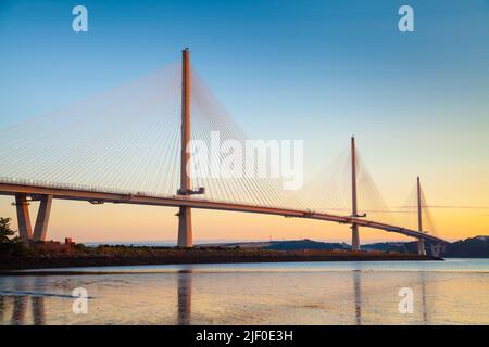 The Queensferry Crossing the new bridge over the Firth of Forth turning golden at sunrise, Edinburgh Scotland. Stock Photo